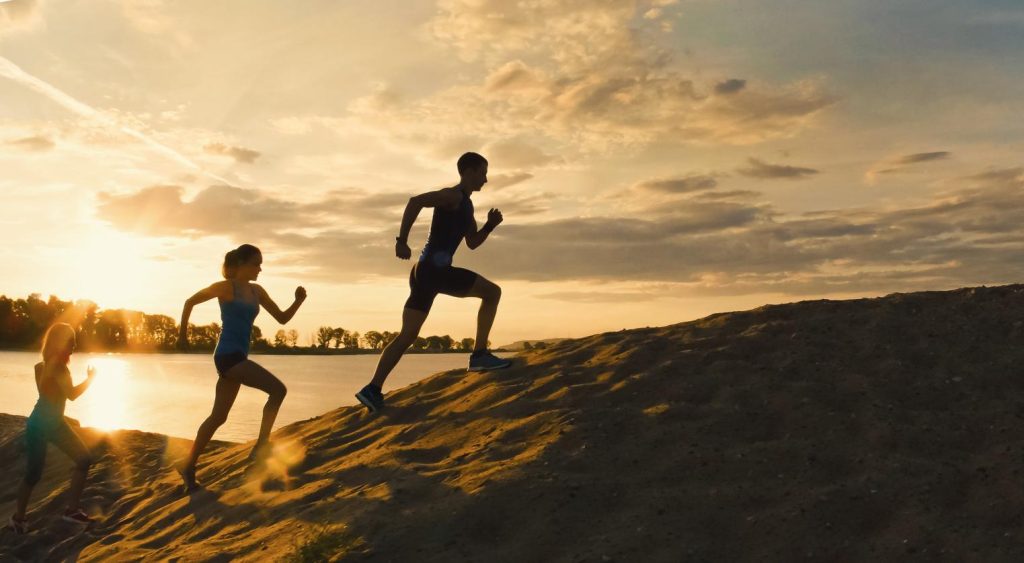 People running in the desert